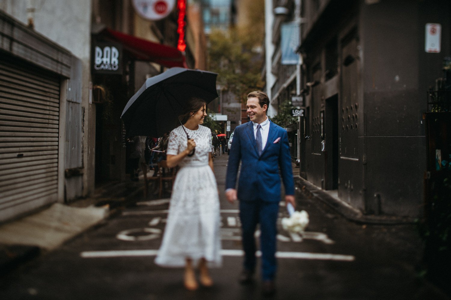 Bride And Groom Standing In Melbourne Alleyway With Umbrella