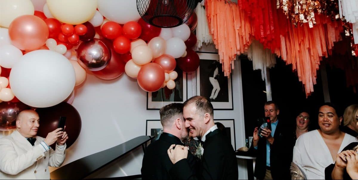 Two- Grooms Embrace During First Dance In Melbourne Wedding At Home