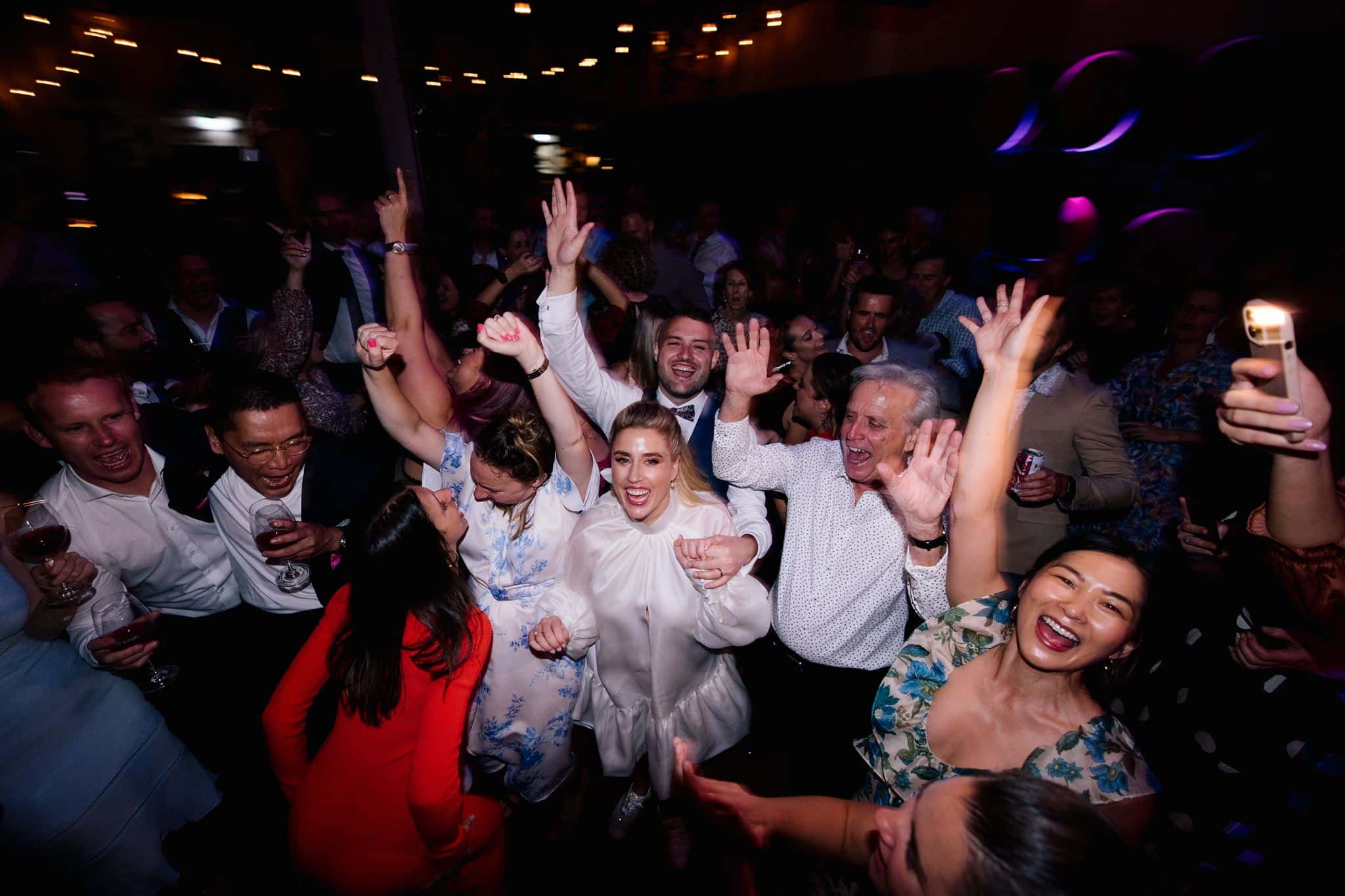 Bride and Groom Dancing At Noisy Ritual Wedding