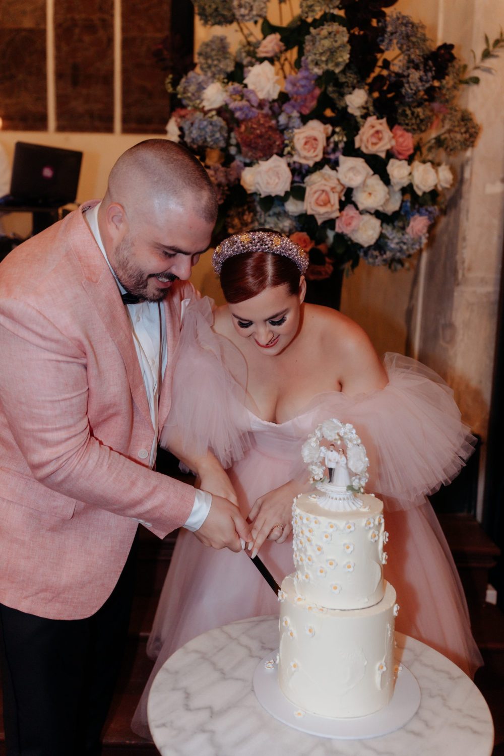 Bride and Groom in Pink Cut Cake At Churchill Wedding Photographed by Bianca Virtue