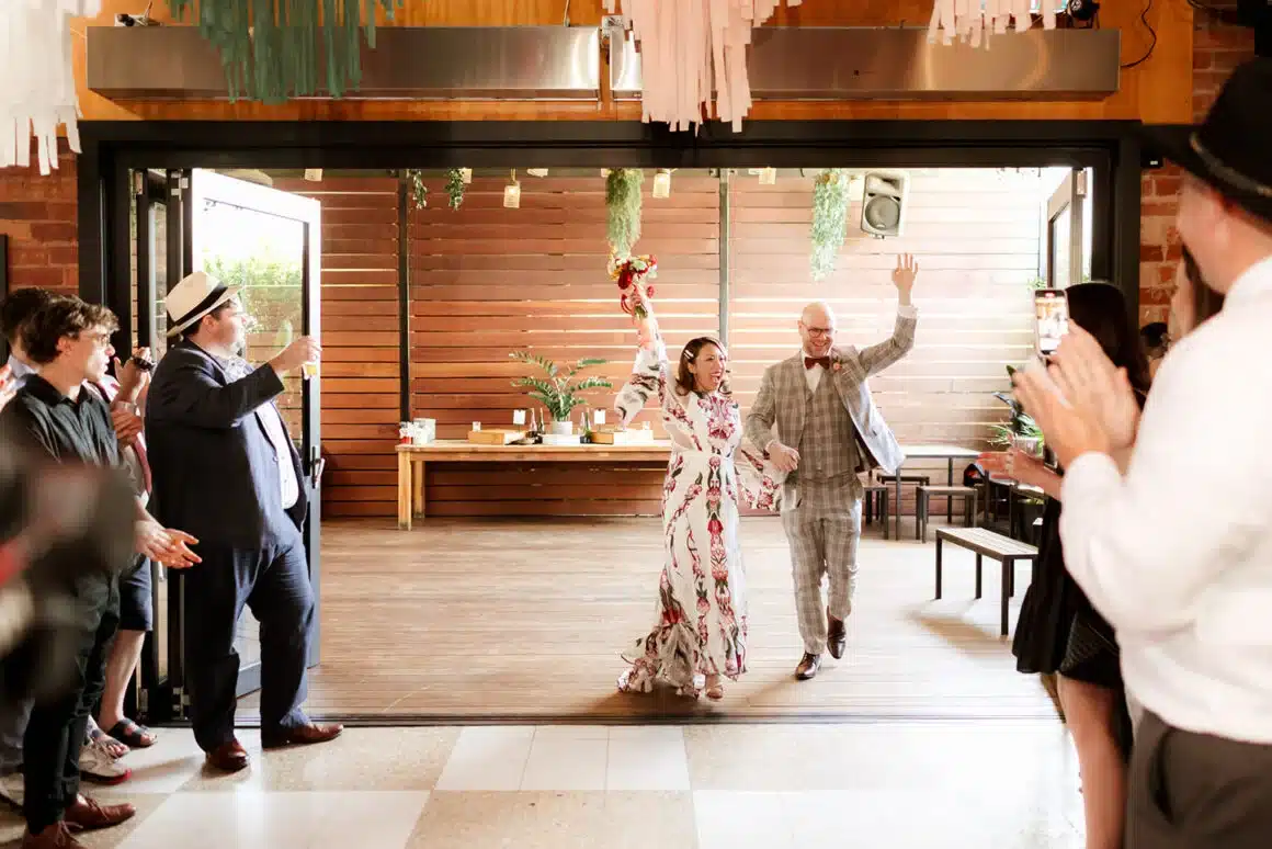 Jen and Nik Colourful Wedding Entrance The Post Office Hotel Coburg Photographed by Nikki McCrone