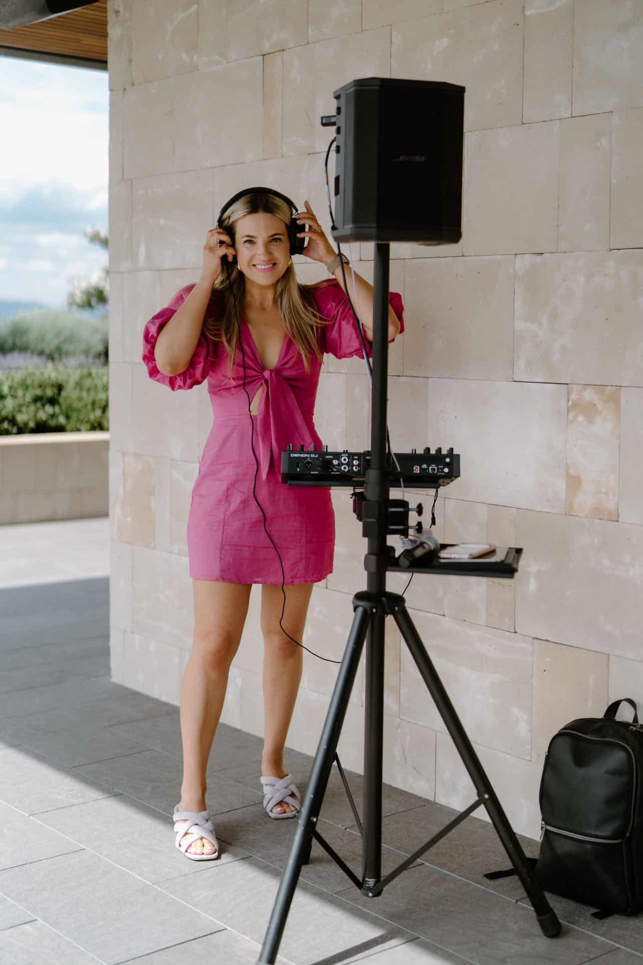 Melbourne Celebrant DJ Aleks Mac with her Speaker and DJ decks at a ceremony